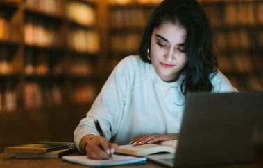 woman studying for north carolina real estate license exam