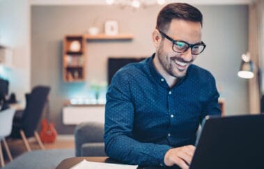 Businessman using laptop at home