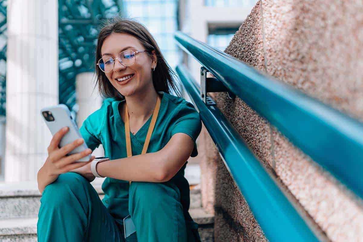 nurse in sitting in stairway can easily change careers to real estate